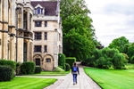 A student walking past King's college at Cambridge University