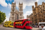 London's famous double-decker busses in front of Westminster Abbey