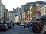 Lower Marsh, Waterloo Market stalls line this narrow street which runs parallel to the side of Waterloo station (© Stephen McKay, CC BY-SA 2.0)