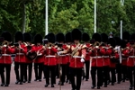 Royal guards marching towards the Buckingham Palace​ in London at St. James Park