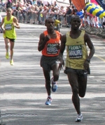 The top three men, Samuel Wanjiru, Tsegay Kebede, and Jaouad Gharib, near the end of the 2009 marathon (© SilkTork, CC BY 2.0)