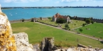 Portchester's outer bailey with the church as seen from the keep (© Joe D, CC BY-SA 3.0)