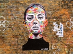 A graffiti of a woman at Brick Lane, East London