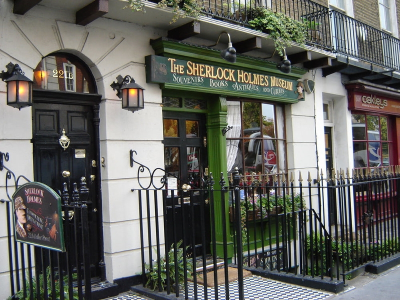 Photo showing the address as 221B beside the location of the Sherlock Holmes Museum in London