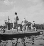 A group of swimmers walk out to the diving boards of the Lido at Hyde Park, London. During the later years of the war 1939-1945