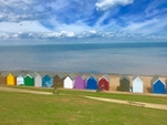 The pastel coloured beach huts that line Whitstable's shoreline