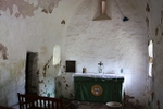 Interior of the chapel on La Hougue Bie. The building dates back to medieval times, but has been heavily altered and rebuilt in the 1930s. (© Bob Embleto, CC BY-SA 2.0)