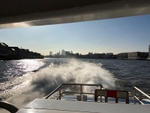The view back to central London from a Thames Clipper heading east